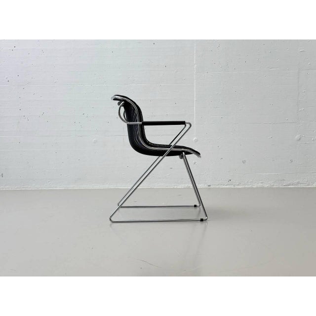 These chairs are the "penelope" model, designed by charles pollock in 1982 and produced by the renowned italian...