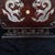 A vintage Chinese table screen (pingfeng) of rectangular form with cloud-scrolled ruyi corners, raised on a matching...