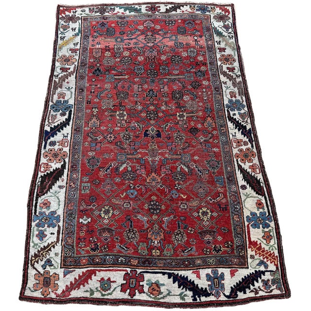 A fabulous antique rug, woven in the village of Bidjar circa 1900. The design is based on a Herati pattern but is more...