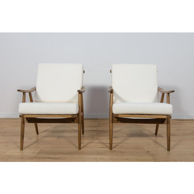 This pair armchairs was produced by the Czechoslovak company TON in the 1960s. The beech elements have been cleaned from...