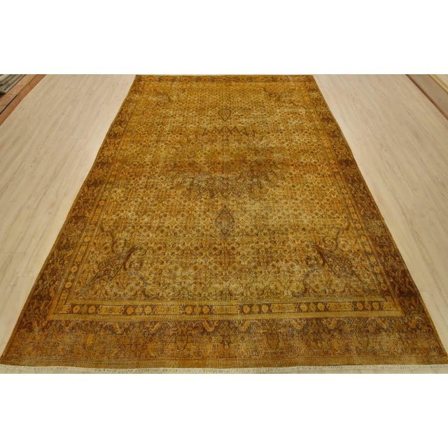 An authentic vintage traditional Overdyed Mood rug hand-knotted with an all-wool pile on a cotton foundation. This...