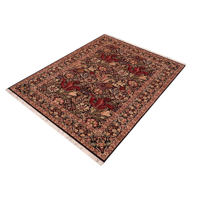 Elevate your space with this handmade Pak Persian wool area rug, expertly knotted to showcase exceptional detail and...