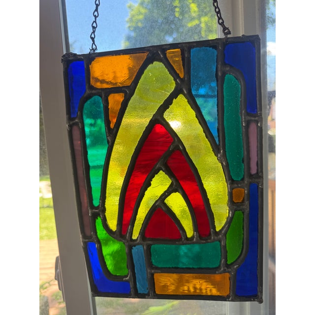 Vintage leaded stained glass window panel with a striking geometric design reminiscent of the Art Deco period. Deep cobalt...