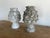 Pair of 19th century weathered stone artichoke finials. They are all hand chiseled and have bulbous shapes with a layered,...