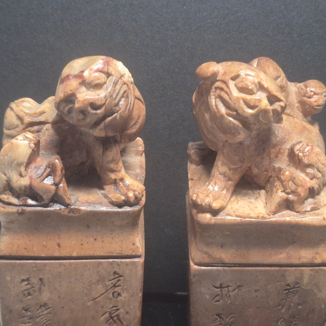 A fine pair of Chinese stone carved temple seals with foo dog decorations, probably dating to the 19th century, with...