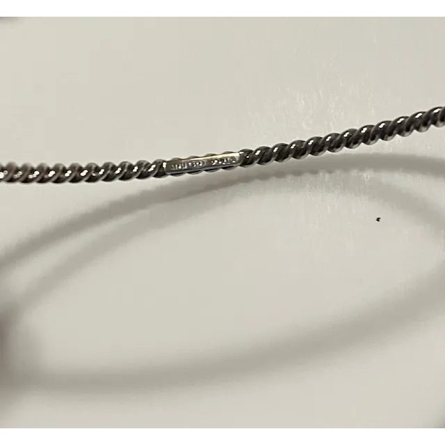 A timeless Tiffany & Co. sterling silver twisted rope cable bangle, discontinued and in brand new, never-worn condition -...