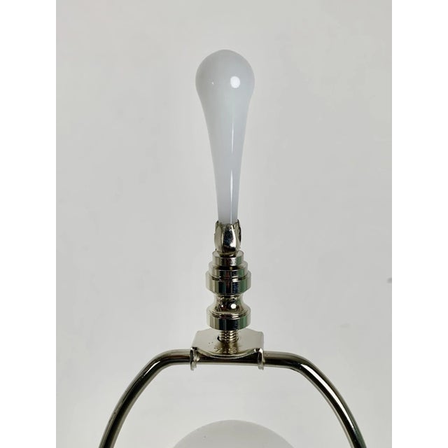 A stunning pair of Venetian glass table lamps from the 1970s, showcasing the timeless elegance of Italian craftsmanship....