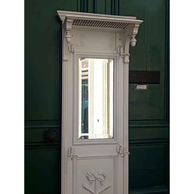 Louis XVI style wooden and cane coat rack Napoleon III period. Repainted white. Carved decoration of torches and ribbons....