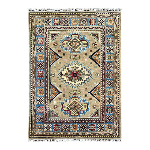 Beige Persian Style Kazak Wool Rug With Blue Border, 4'2" X 5'10" For Sale