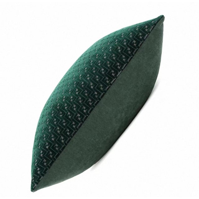 This throw pillow, with its deep and rich emerald green hue and intricate three-dimensional jacquard pattern, exudes a...