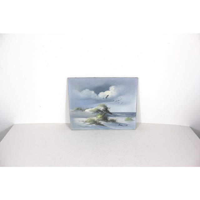 This is a beautiful painting of a beach scene, with seagulls, sand dunes, pampas grass, blue sky and waves. It is oil on...