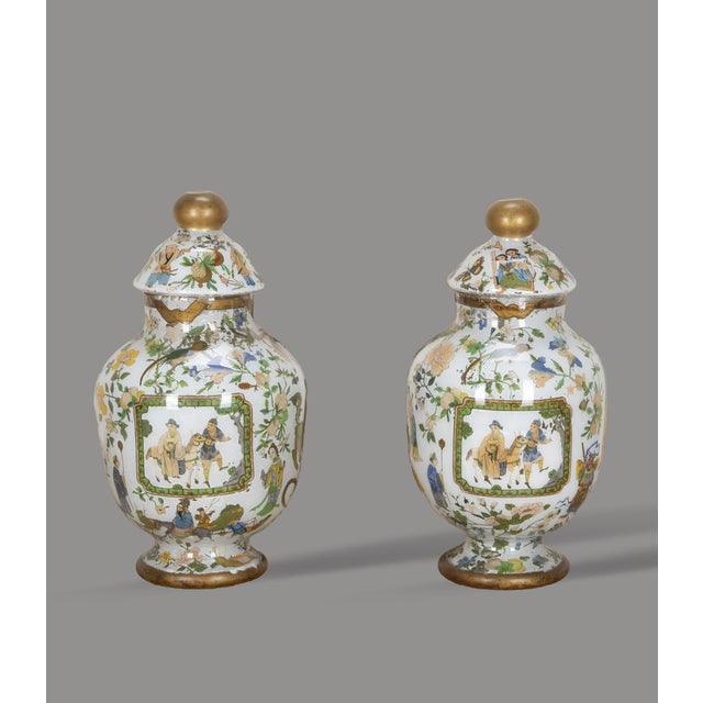 An excellent pair of mid 19th Century lidded decalcomania vases, externally decorated with gold finials and socles,...
