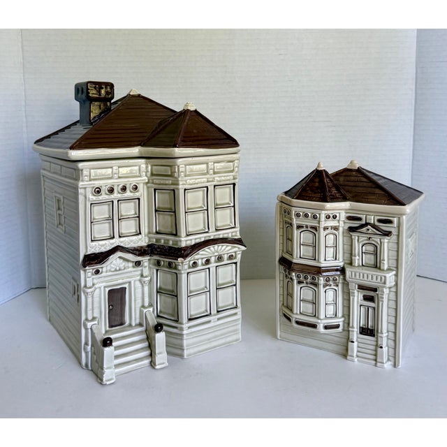 Here is a charming pair of Otagiri ceramic canisters dating to 1979 and 1980, designed as wonderfully detailed San...