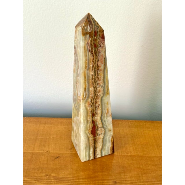 A stunning neoclassical or Grand Tour style solid marble onyx green and brown obelisk. Most items found at Pub & Oasis are...