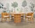 An exceptional labeled set of four rare barrel-back dining armchairs made by McGuire artisans in San Francisco, CA. This...