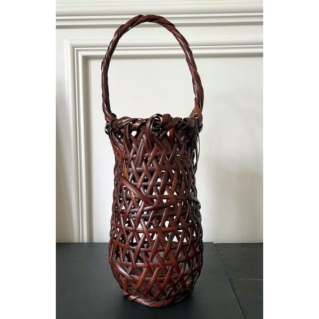 An elegantly woven bamboo basket with handle as an ikenana container by Suzuki Gengensai (1891-1950) circa 1923-50. Suzuki...