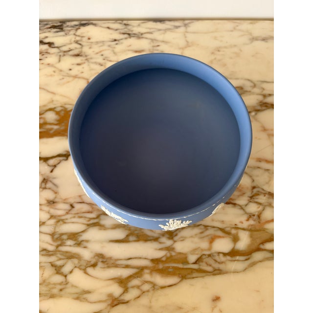 Beautiful light blue (lavender) matte jasperware with crisp white decorative reliefs. Lovely pedestal bowl stamped Wedgwood.
