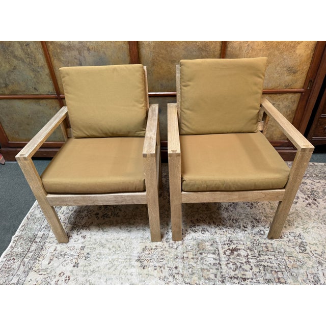 Design Plus Gallery presents a Pair of Arm Chairs from Williams-Sonoma Home. These matches conversation chairs have a...