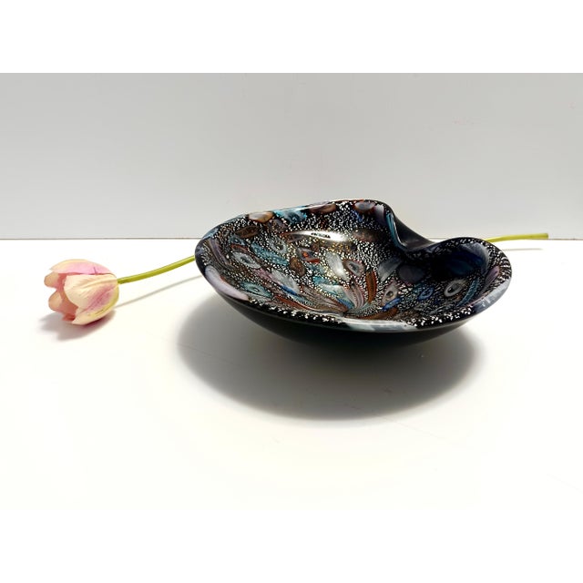 Made in Italy, 1960s. This ashtray / catchall is made in Murano glass. It is a "Tutti frutti" model. This is a vintage...