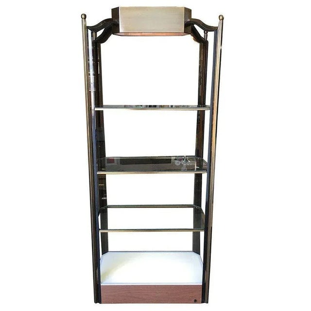 Post Modern glass light-up etagere with a bronze wash frame, smoked glass shelves, and acrylic accents. The shelf features...