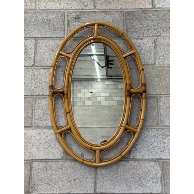 Wonderful French style bamboo and rattan mirror circa 1970s. Great design with bamboo frame and some cane wrap. Beautiful...