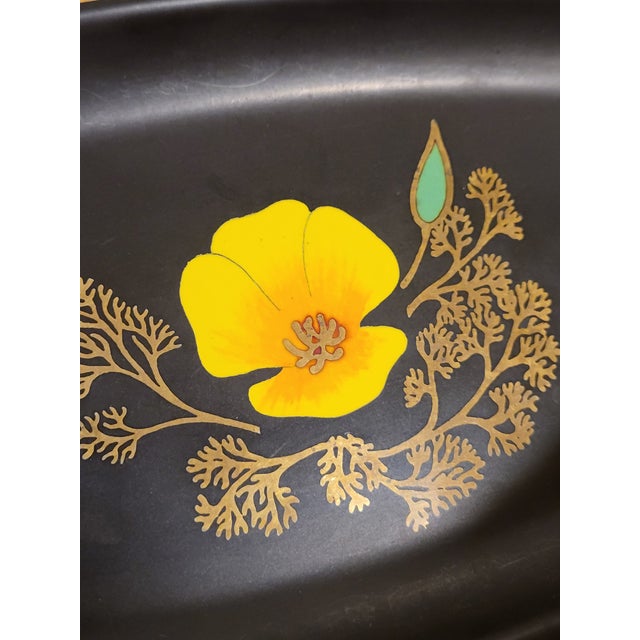 A wonderful vintage rectangular tray. The image of a california poppy in the center of the dish is formed from small...
