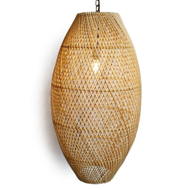 Natural rattan bead shaped lantern. Great displayed in groupings. Each may vary in natural coloring and other...