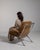 Chrome-frame lounge chair in Warm Burnt Orange. Its warm burnt orange finish sets off tubular chrome frame, burnt orange...
