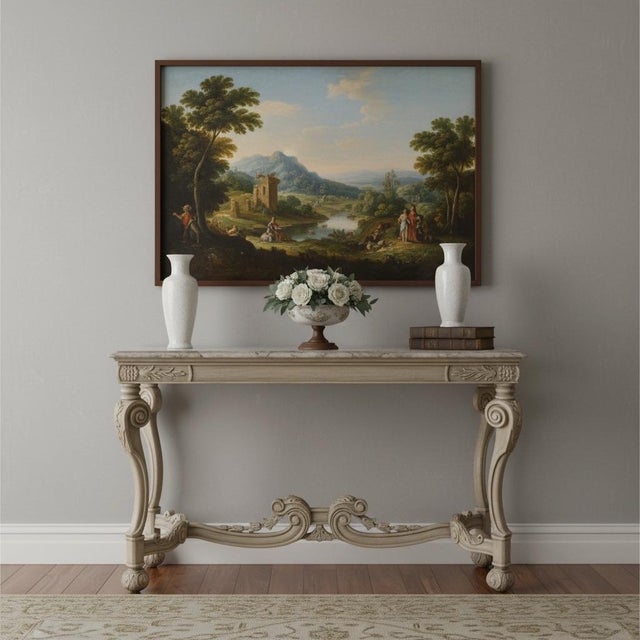 This is a heavily carved Italian console table with faux marbleized painted top. It is in very good condition. It has...