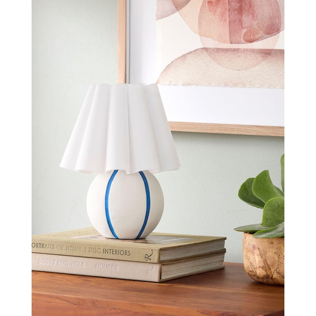 Illuminate your space with the Kinki accent table lamp, a captivating blend of Arts & Crafts Traditional style that...