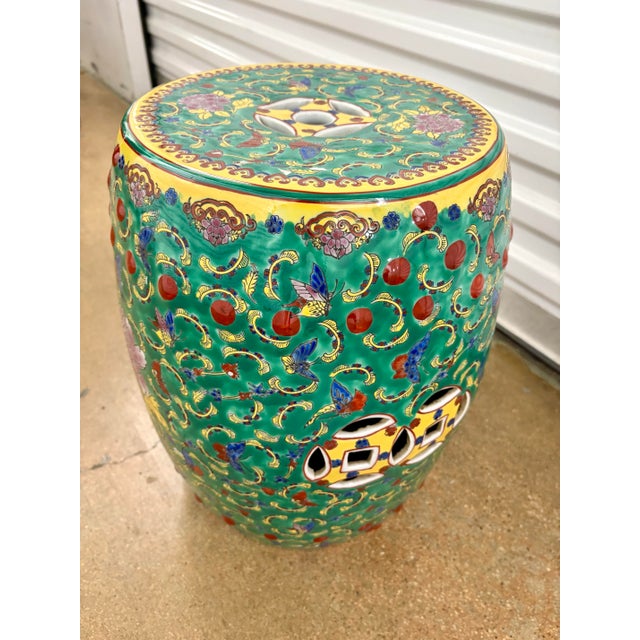 Chinese Enameled Porcelain Garden Seat with repeating foliates on green ground. Approx. 17"H and 12" diameter. No chips or...