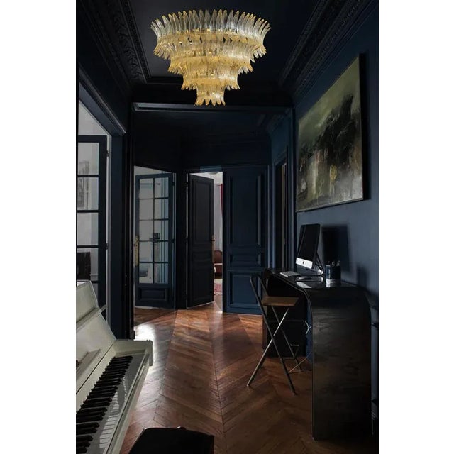 Palmette chandelier made by Murano trasparent glasses in a gold metal frame. Murano blown glass in a traditional way....