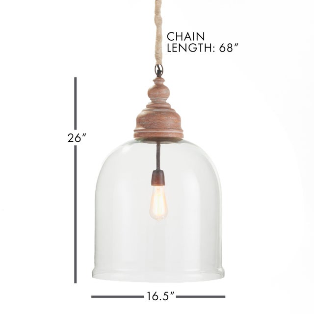 Alone or as a pair, this oversized cloche pendant is an elegant mix of glass and wood. You don, t have to be a vintner to...