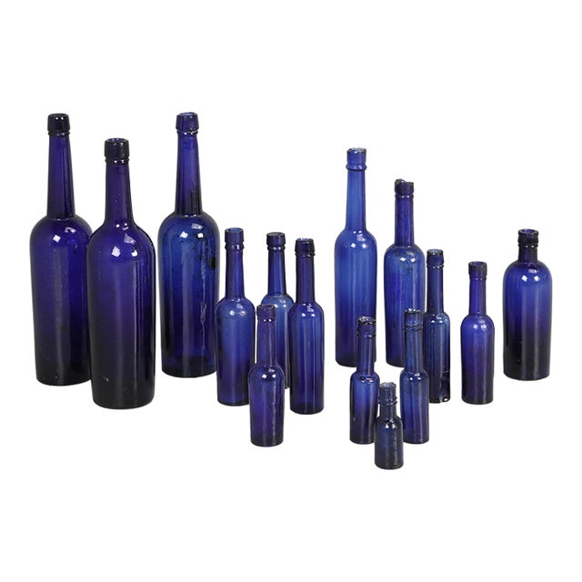 Collection of '15' Cobalt Blue Caster Oil Hand Blown Bottles Made in 1800s For Sale