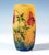 Cylindrical vase, colourless glass with flaky yellow-orange, with brown powder inclusions in the lower section, highly...