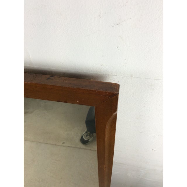 This mid century modern mountable mirror features hardwood construction, walnut frame with original finish, painted metal...