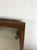 This mid century modern mountable mirror features hardwood construction, walnut frame with original finish, painted metal...