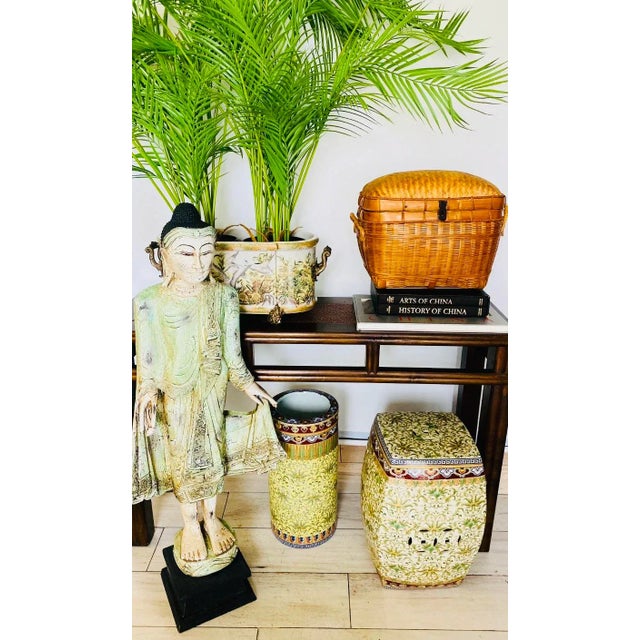 A Chinese Elmwood console table from the early 20th century, with rattan top insets. This is the perfect table to float in...