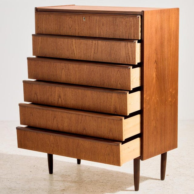 Restored Danish teak dresser with six drawers and unique handles from the 1960s. Exciting shades of teak, clean details...