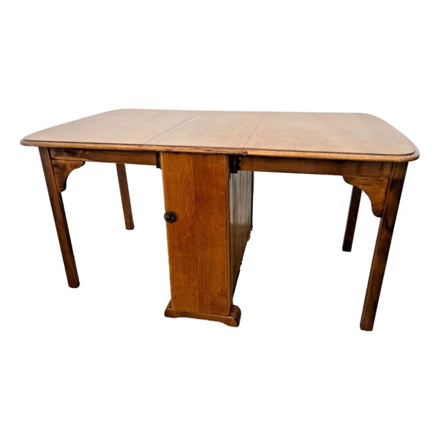 1960s Vintage Gate Leg Table Drop Down Sides Two Drawers and Cabinet Rectangle Oak For Sale