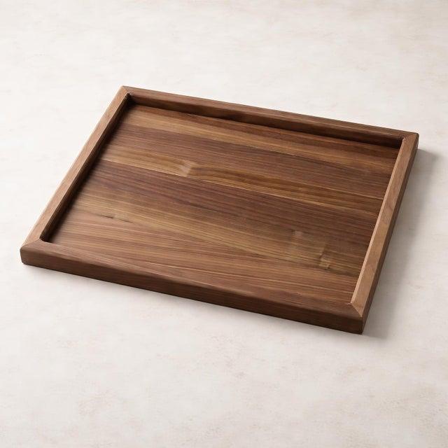 Handcrafted serving tray made from solid American black walnut — full-thickness hardwood, no veneer or plywood. Clean...