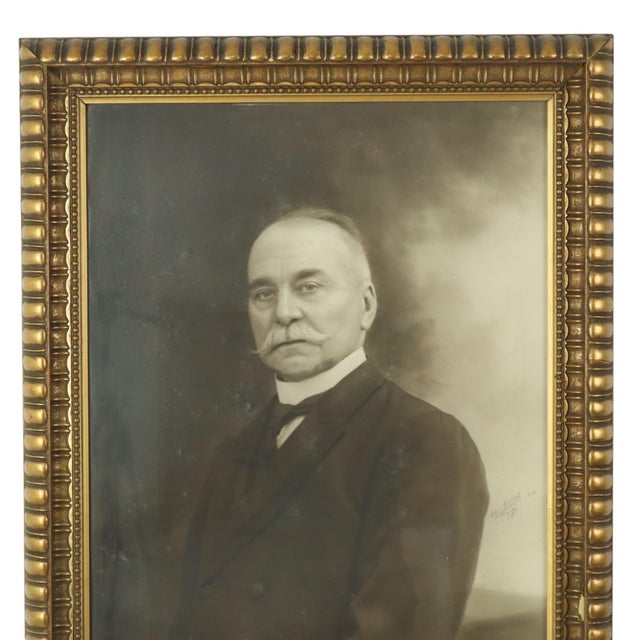 A beautiful vintage photograph—a portrait of an older man—housed in a gold frame made of wood and resin; signed and dated...
