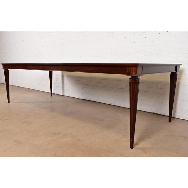 A gorgeous French Regency Louis XVI or Neoclassical style extension dining table By John Widdicomb for Bexley Heath USA,...