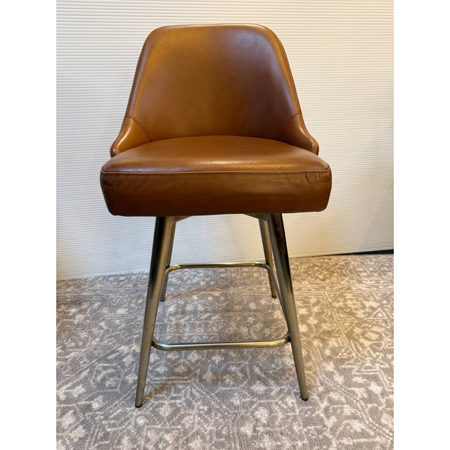 Design Plus Gallery presents a Mid Century Swivel Stool from West Elm. Presents timeless mid-century design to your space...