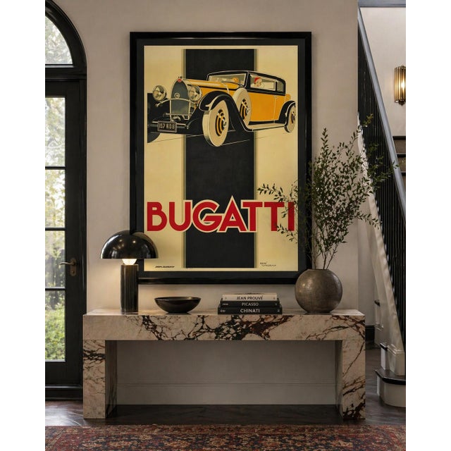 Monumental and visually striking vintage lithograph poster depicting the iconic Bugatti Type 46, originally designed in...