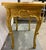 A vintage reproduction Louis XV style giltwood side table with cabriole legs with carved scroll feet and carved rococo...