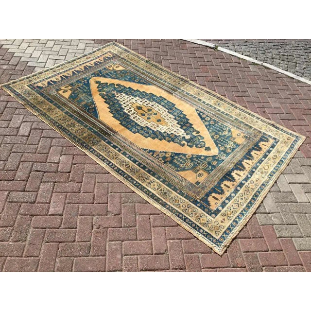 This gorgeous hand-knotted rug was made in about 1950's by Anatolian tribals. Collectible rug is made with all hand spun...