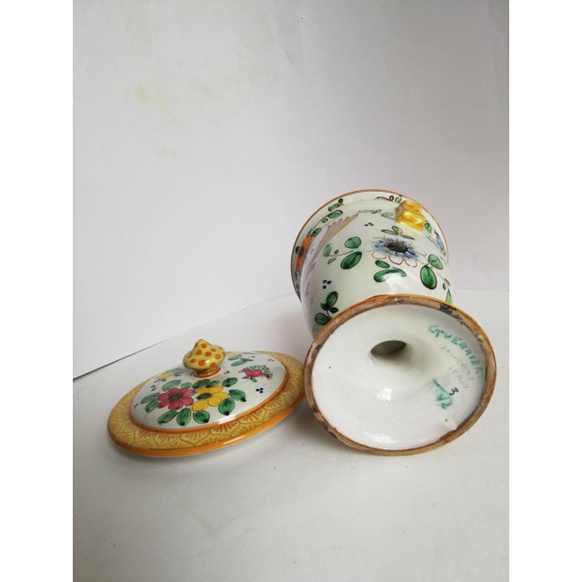 This terracotta piece features polychrome decoration in enamels. It is signed Guerrieri Murano.