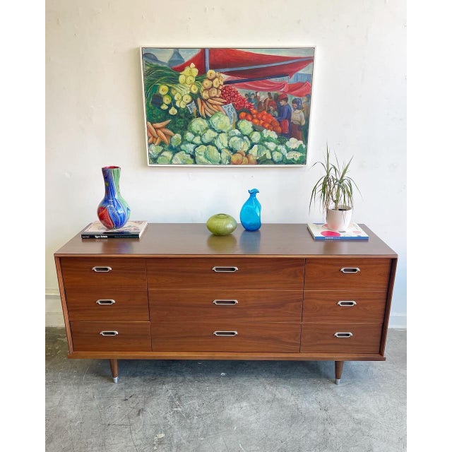 Beautiful mid-century modern walnut triple dresser by B.P. John Furniture Co., circa 1960s . This piece has been...