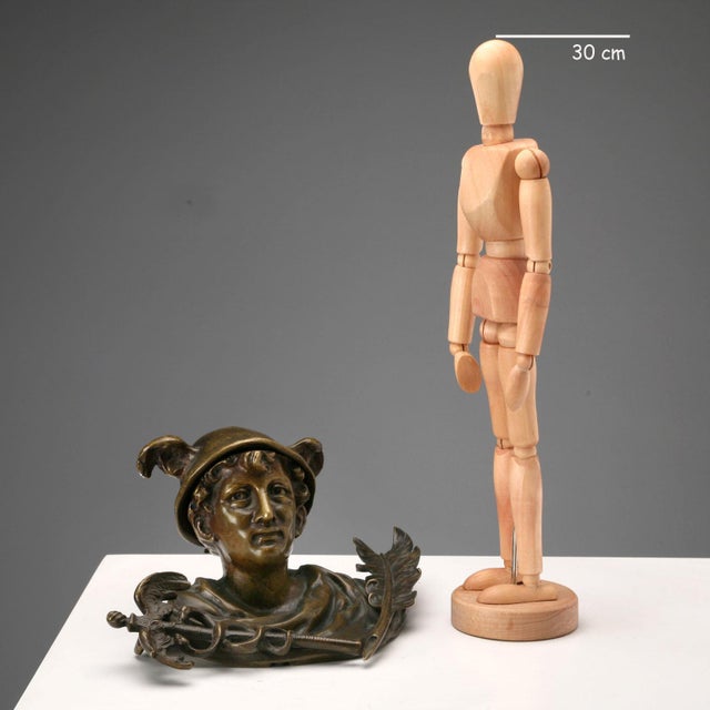 Bronze inkwell depicting the god Mercury with a scepter wrapped in snakes and a quill. Lid in the shape of a winged...